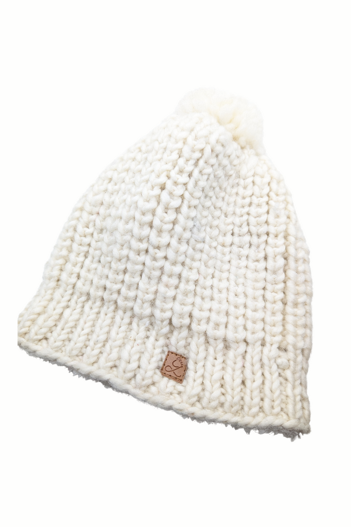 Tuque en laine doublée en polar avec pompon – chaleur et confort