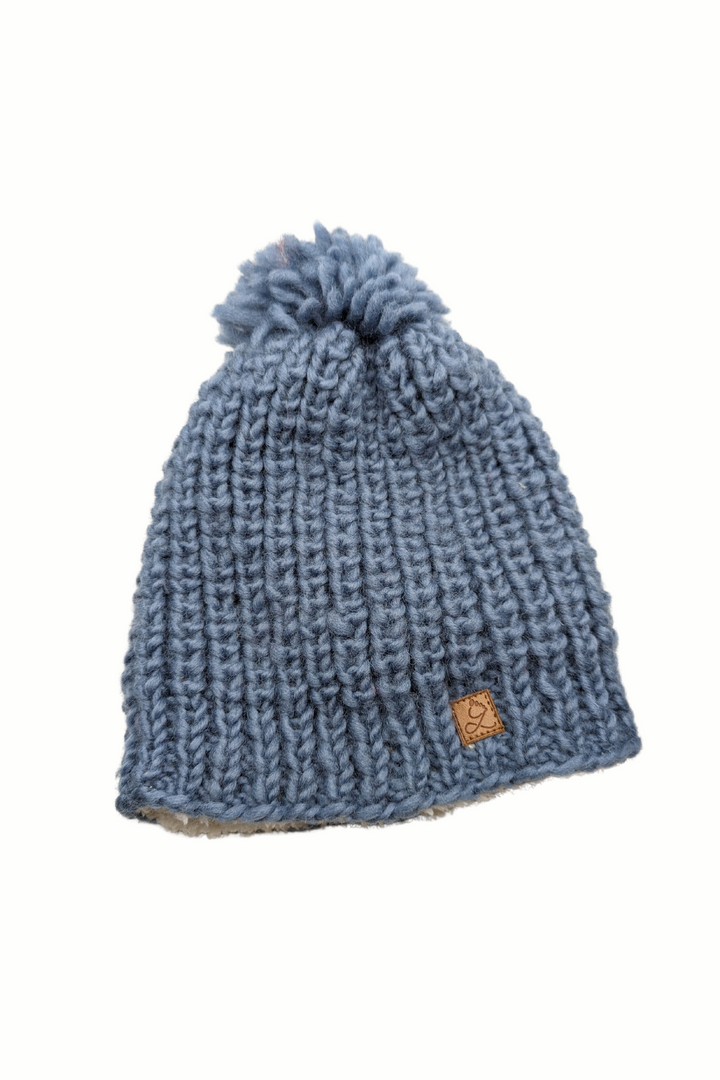 Tuque en laine doublée en polar avec pompon – chaleur et confort