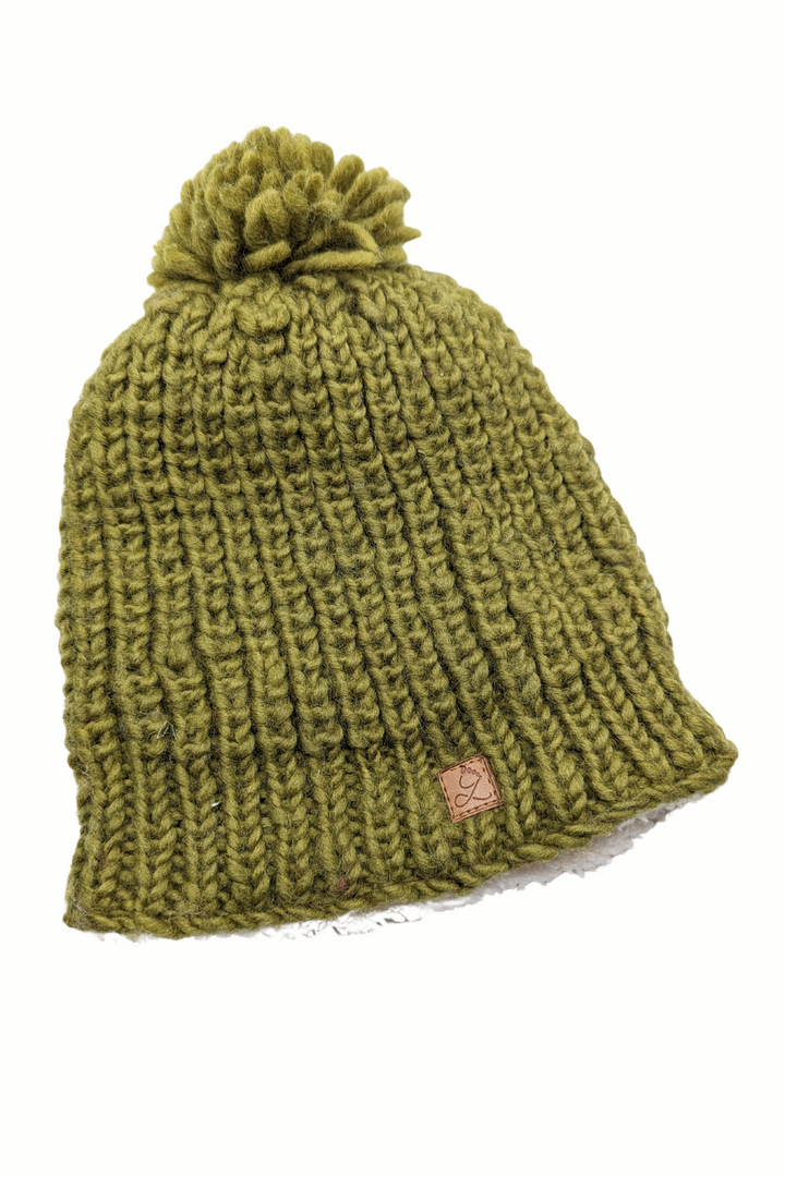 Tuque en laine doublée en polar avec pompon – chaleur et confort