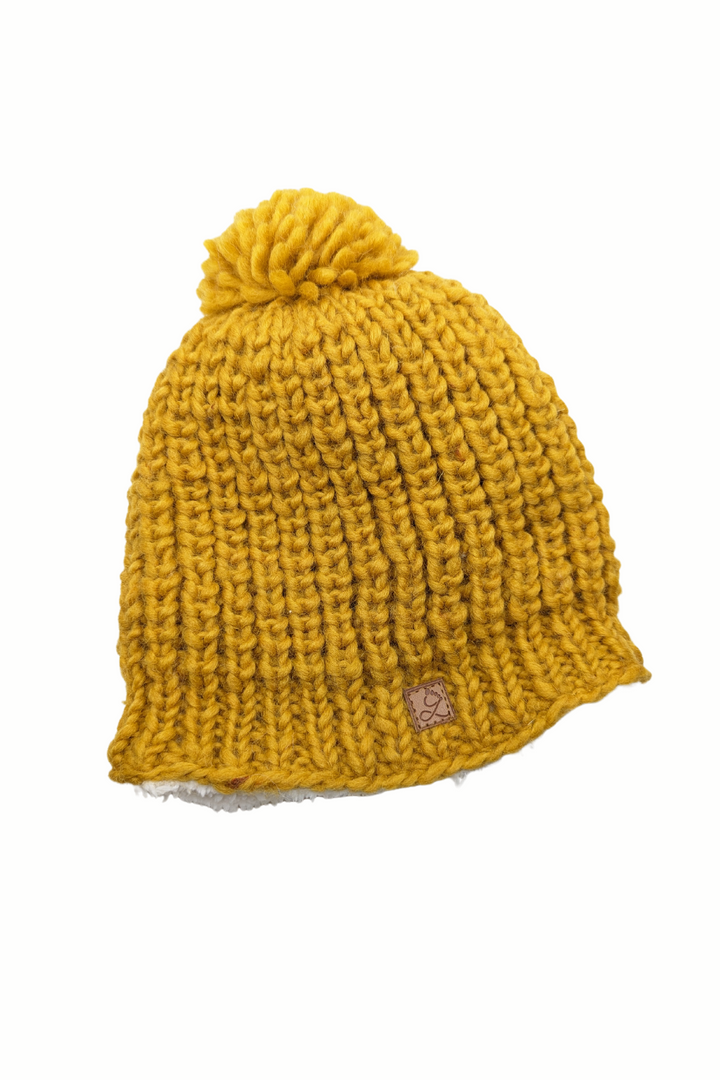 Tuque en laine doublée en polar avec pompon – chaleur et confort