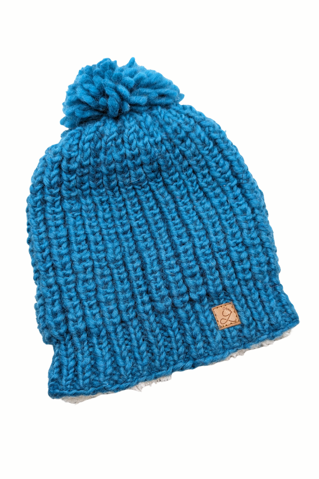 Tuque en laine doublée en polar avec pompon – chaleur et confort