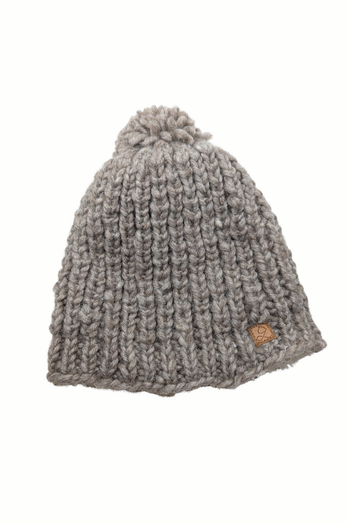 Tuque en laine doublée en polar avec pompon – chaleur et confort