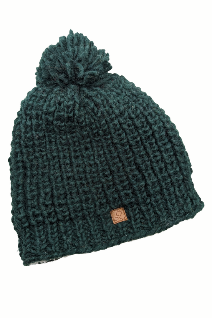 Tuque en laine doublée en polar avec pompon – chaleur et confort